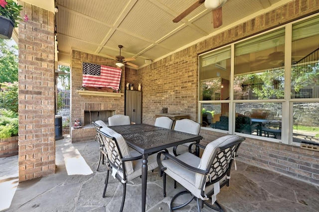 411 Torrington Dr, Austin, TX 78737 - view of patio / terrace featuring an outdoor brick fireplace, ceiling fan, and outdoor dining space