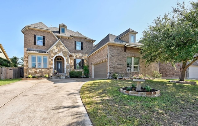 411 Torrington Dr, Austin, TX 78737 - view of front of property with concrete driveway, an attached garage, brick siding, and stone siding