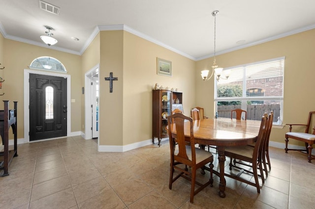 411 Torrington Dr, Austin, TX 78737 - dining area with a chandelier, light tile patterned floors, baseboards, and crown molding