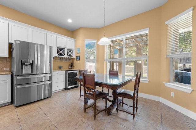 411 Torrington Dr, Austin, TX 78737 - dining room featuring beverage cooler, a dry bar, light tile patterned floors, recessed lighting, and baseboards