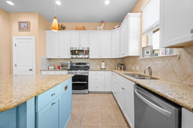 411 Torrington Dr, Austin, TX 78737 - kitchen featuring appliances with stainless steel finishes, a sink, white cabinetry, and recessed lighting