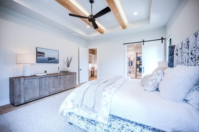 104 Megan Ln, Horseshoe Bay, TX 78657 - bedroom featuring beam ceiling, recessed lighting, a barn door, wood finished floors, and ceiling fan