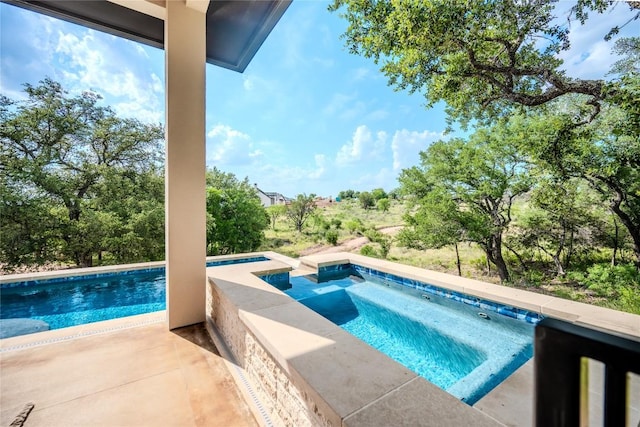 104 Megan Ln, Horseshoe Bay, TX 78657 - view of pool featuring a patio area and a pool with connected hot tub