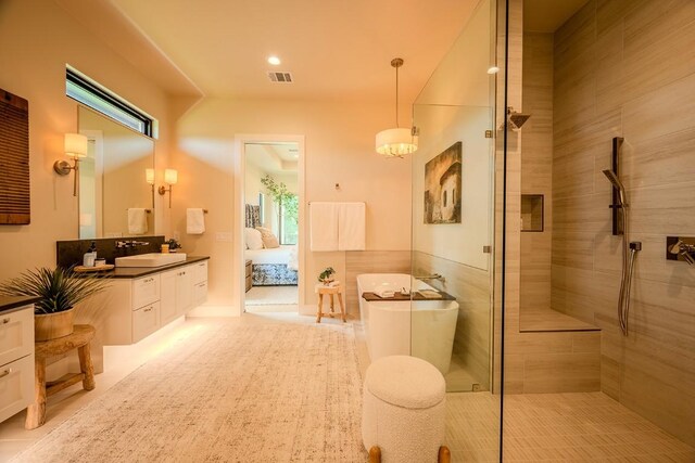104 Megan Ln, Horseshoe Bay, TX 78657 - bathroom with vanity, a freestanding tub, ensuite bathroom, and tiled shower