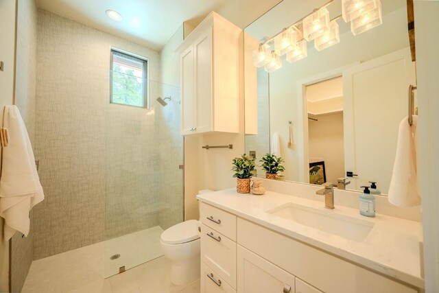 104 Megan Ln, Horseshoe Bay, TX 78657 - bathroom with vanity, toilet, walk in shower, and tile patterned floors