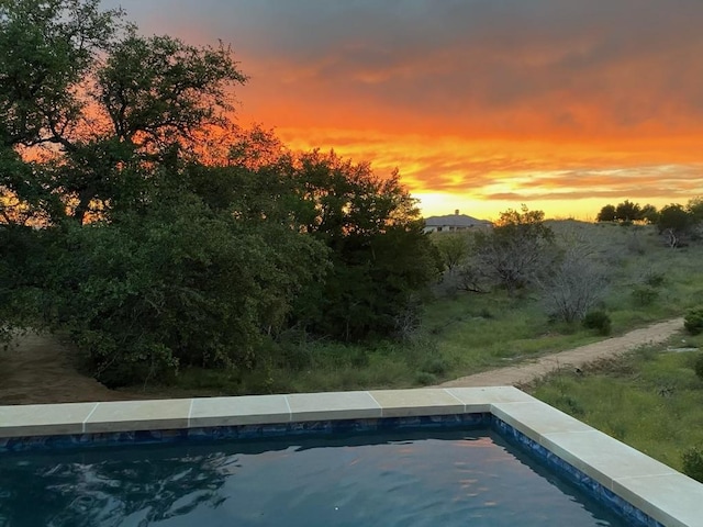 104 Megan Ln, Horseshoe Bay, TX 78657 - pool at dusk with an outdoor pool