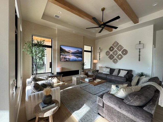 104 Megan Ln, Horseshoe Bay, TX 78657 - living room with ceiling fan, beamed ceiling, and wood finished floors