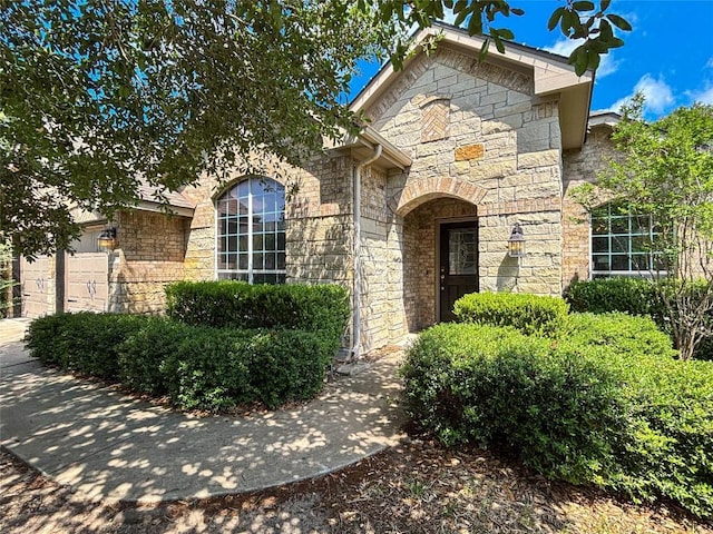 11708 Pillion Pl, Manor, TX 78653 - french provincial home with stone siding and a garage