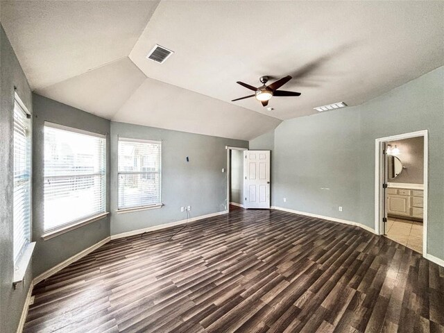 11708 Pillion Pl, Manor, TX 78653 - unfurnished bedroom with vaulted ceiling, wood finished floors, ensuite bathroom, baseboards, and ceiling fan