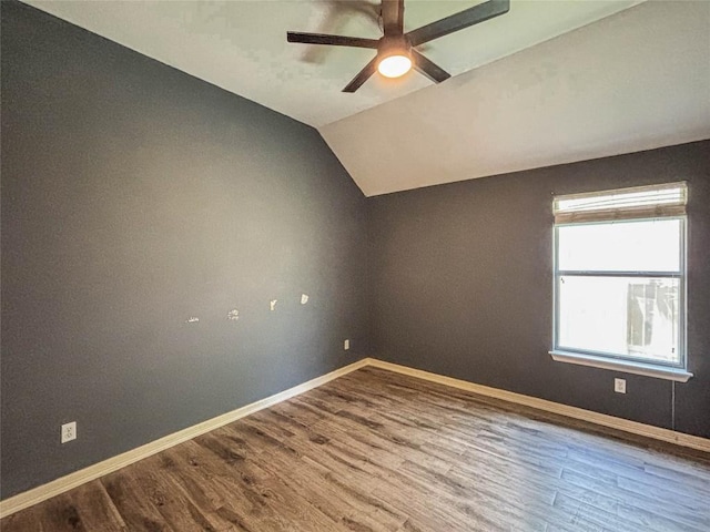 11708 Pillion Pl, Manor, TX 78653 - empty room with vaulted ceiling, a ceiling fan, baseboards, and wood finished floors