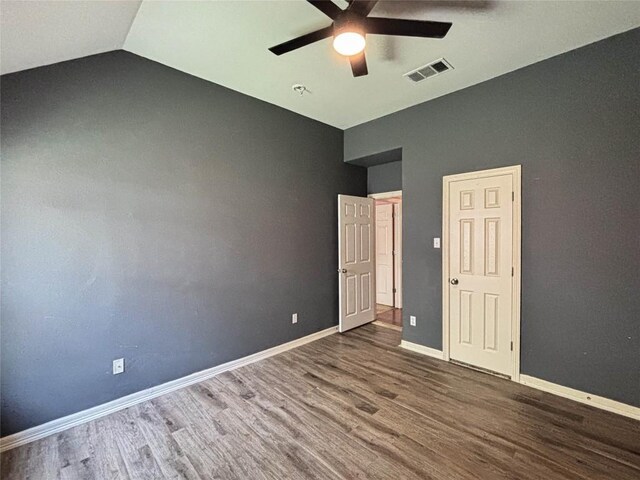 11708 Pillion Pl, Manor, TX 78653 - unfurnished bedroom featuring wood finished floors, baseboards, lofted ceiling, and ceiling fan