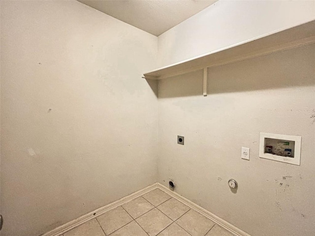 11708 Pillion Pl, Manor, TX 78653 - washroom with hookup for a washing machine, baseboards, electric dryer hookup, and light tile patterned flooring