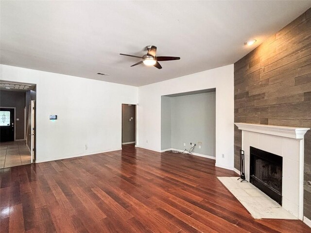 11708 Pillion Pl, Manor, TX 78653 - unfurnished living room with ceiling fan, wood finished floors, a fireplace, and baseboards