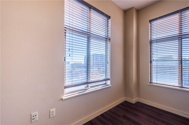 711 W 26th St Unit 703, Austin, TX 78705 - empty room with baseboards and dark wood-style flooring