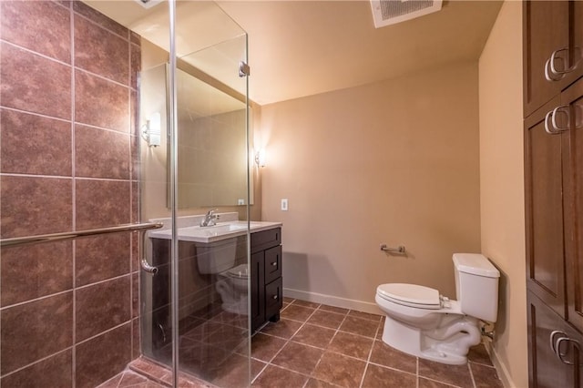 711 W 26th St Unit 703, Austin, TX 78705 - full bath featuring toilet, vanity, a stall shower, and tile patterned floors