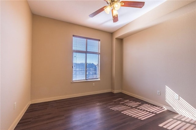 711 W 26th St Unit 703, Austin, TX 78705 - unfurnished room with dark wood finished floors, baseboards, and ceiling fan