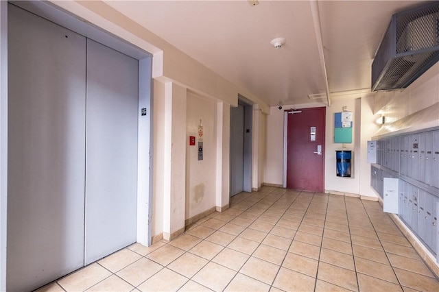711 W 26th St Unit 703, Austin, TX 78705 - hallway featuring elevator, mail area, and light tile patterned floors