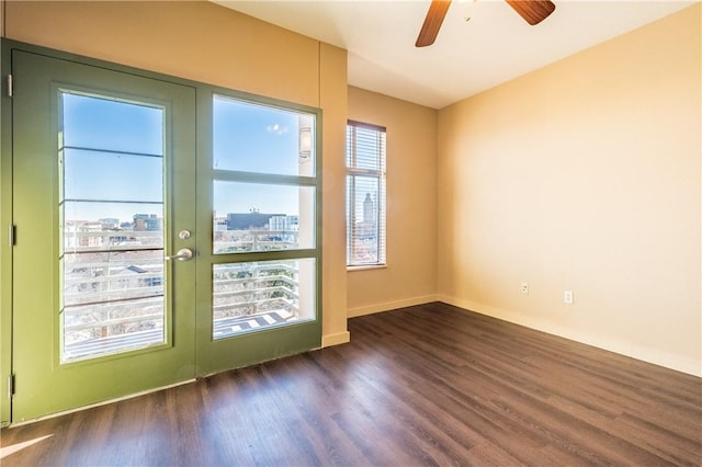 711 W 26th St Unit 703, Austin, TX 78705 - unfurnished room with wood finished floors, a ceiling fan, french doors, and baseboards