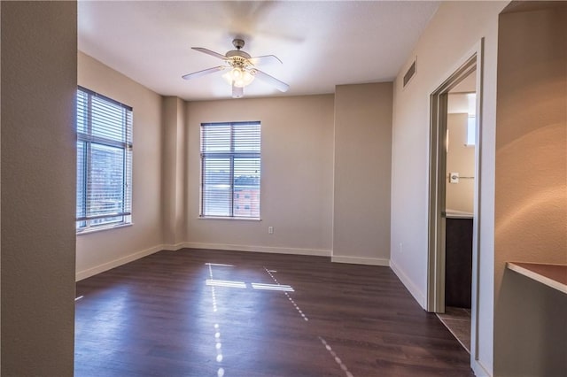 711 W 26th St Unit 703, Austin, TX 78705 - empty room with a ceiling fan, wood finished floors, and baseboards