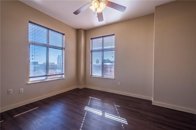 711 W 26th St Unit 703, Austin, TX 78705 - spare room featuring plenty of natural light, baseboards, and wood finished floors