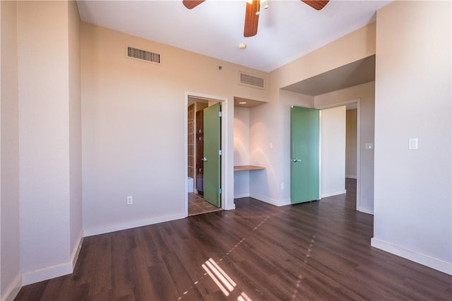 711 W 26th St Unit 703, Austin, TX 78705 - unfurnished room with ceiling fan, dark wood finished floors, and baseboards