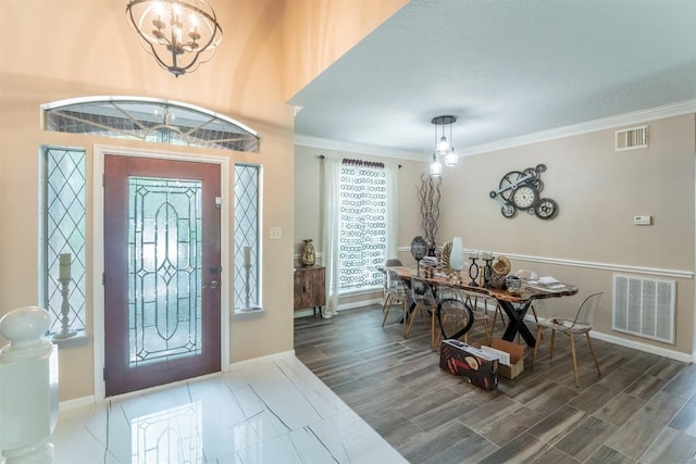 13210 Chriswood Dr, Cypress, TX 77429 - foyer with a chandelier, ornamental molding, and baseboards