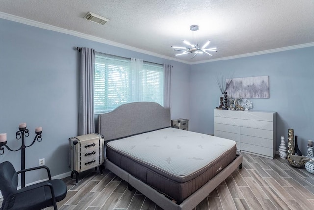 13210 Chriswood Dr, Cypress, TX 77429 - bedroom featuring wood tiled floors, a chandelier, ornamental molding, a textured ceiling, and baseboards