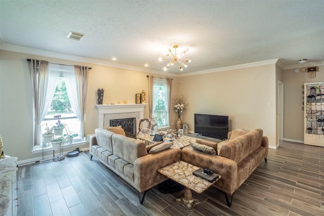 13210 Chriswood Dr, Cypress, TX 77429 - living area featuring a chandelier, wood finish floors, baseboards, a fireplace, and ornamental molding