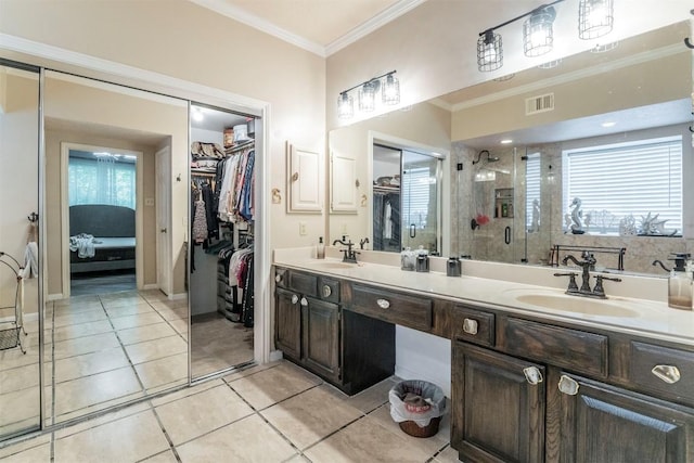 13210 Chriswood Dr, Cypress, TX 77429 - bathroom with a walk in closet, a stall shower, double vanity, ornamental molding, and tile patterned flooring
