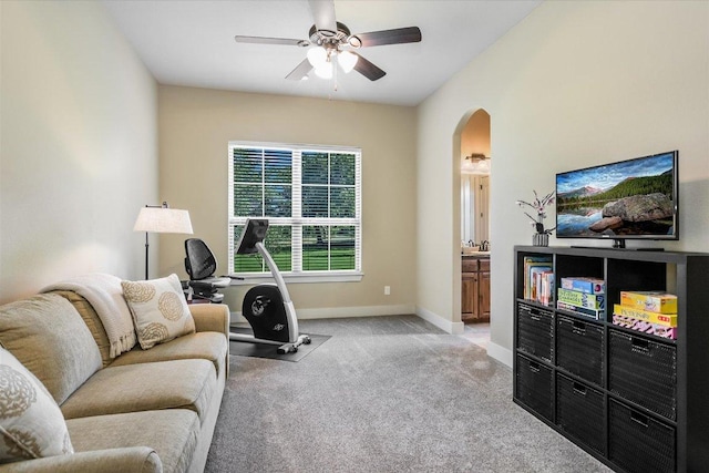 313 Aldea Cv, Georgetown, TX 78633 - living room with ceiling fan, arched walkways, and light colored carpet