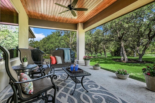 313 Aldea Cv, Georgetown, TX 78633 - view of patio featuring a ceiling fan, view of wooded area, and an outdoor hangout area