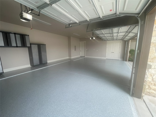 313 Aldea Cv, Georgetown, TX 78633 - garage with a garage door opener and baseboards