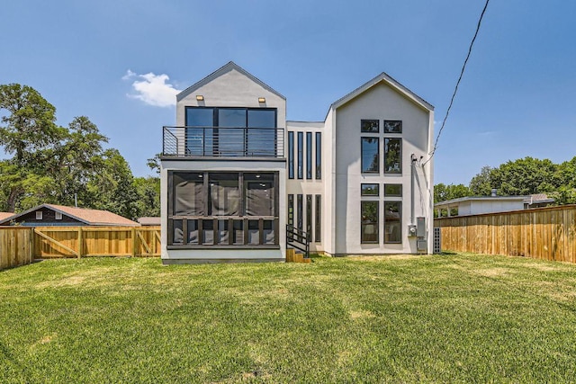 4803 Philco Dr, Austin, TX 78745 - back of property with a balcony, a sunroom, and stucco siding