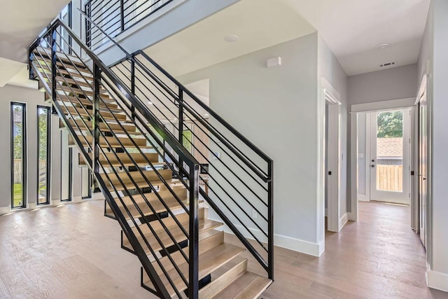 4803 Philco Dr, Austin, TX 78745 - stairs featuring healthy amount of natural light, wood finished floors, and baseboards