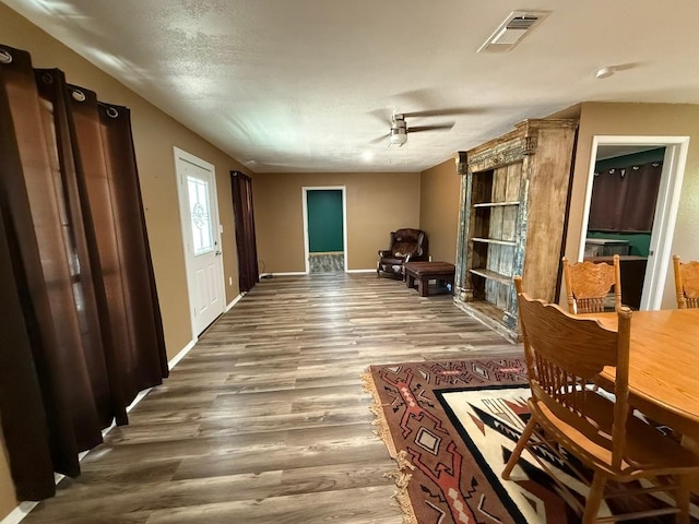 1503 Sioux Trl, Kingsland, TX 78639 - dining space with wood finished floors, ceiling fan, and baseboards
