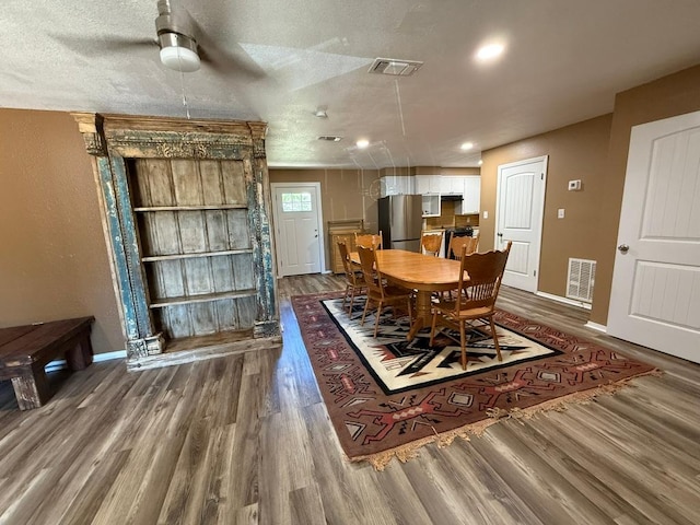 1503 Sioux Trl, Kingsland, TX 78639 - dining room with wood finished floors, baseboards, a textured ceiling, a ceiling fan, and recessed lighting