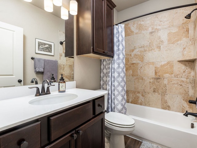500 Cortona Ln, Georgetown, TX 78628 - bathroom with vanity, shower / bath combination with curtain, toilet, and wood finished floors