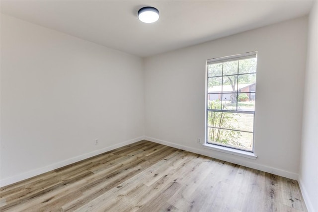 4709 Brassiewood Dr, Austin, TX 78744 - spare room featuring light wood-type flooring and baseboards