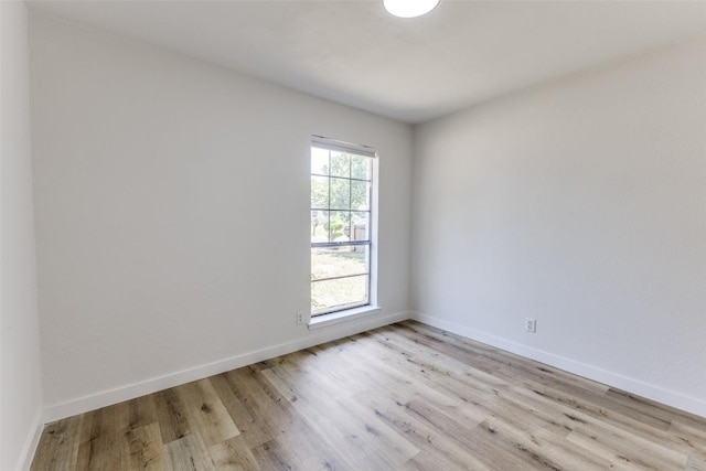 4709 Brassiewood Dr, Austin, TX 78744 - empty room with light wood-type flooring and baseboards