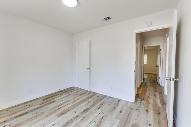 4709 Brassiewood Dr, Austin, TX 78744 - unfurnished room with light wood-style flooring, a smoke detector, and baseboards