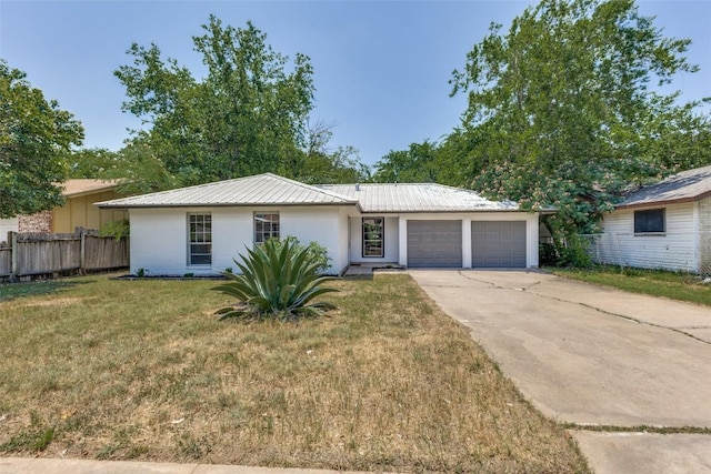 4709 Brassiewood Dr, Austin, TX 78744 - single story home featuring a garage, metal roof, and driveway