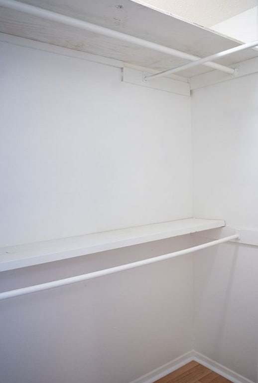 2841 San Gabriel St, Austin, TX 78705 - walk in closet featuring wood finished floors