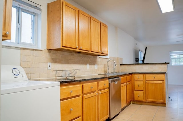 2841 San Gabriel St, Austin, TX 78705 - kitchen with washer / dryer, dishwasher, a sink, a peninsula, and light tile patterned floors