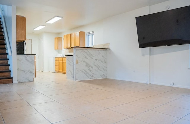 2841 San Gabriel St, Austin, TX 78705 - unfurnished living room featuring stairway, light tile patterned floors, and baseboards