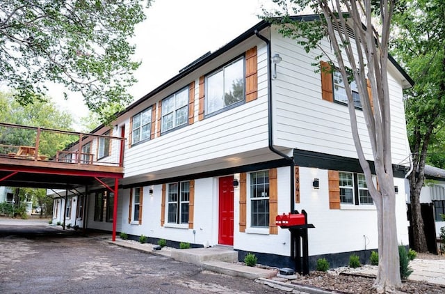 2841 San Gabriel St, Austin, TX 78705 - townhome / multi-family property featuring driveway and a wooden deck