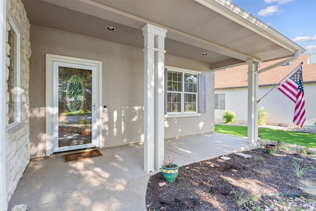 712 Texas Dr, Georgetown, TX 78633 - entrance to property featuring stucco siding and a patio area