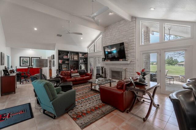 2704 Aurora, Horseshoe Bay, TX 78657 - living room featuring beamed ceiling, high vaulted ceiling, ceiling fan, a fireplace, and light tile patterned floors