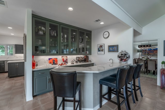 2704 Aurora, Horseshoe Bay, TX 78657 - indoor wet bar with decorative backsplash, light tile patterned flooring, and recessed lighting
