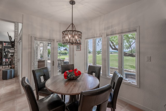 2704 Aurora, Horseshoe Bay, TX 78657 - dining area featuring light tile patterned floors and a chandelier