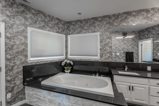 2704 Aurora, Horseshoe Bay, TX 78657 - bathroom with vanity and a jetted tub
